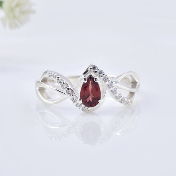 0.70 Ct Pear Shape Rhodonite Garnet Infinity Twist Ring 925 Sterling Silver