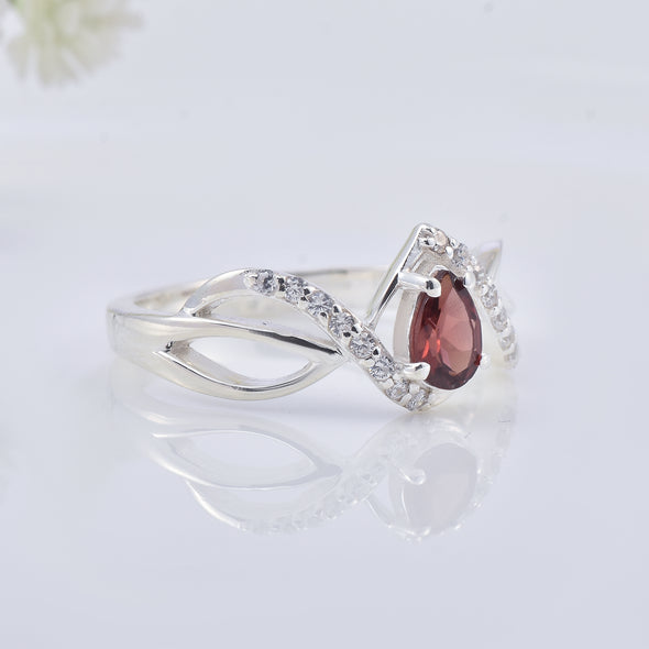 0.70 Ct Pear Shape Rhodonite Garnet Infinity Twist Ring 925 Sterling Silver