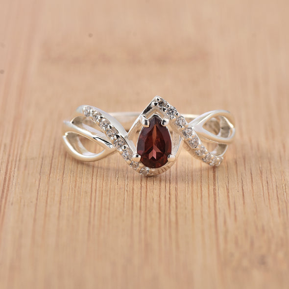 0.70 Ct Pear Shape Rhodonite Garnet Infinity Twist Ring 925 Sterling Silver