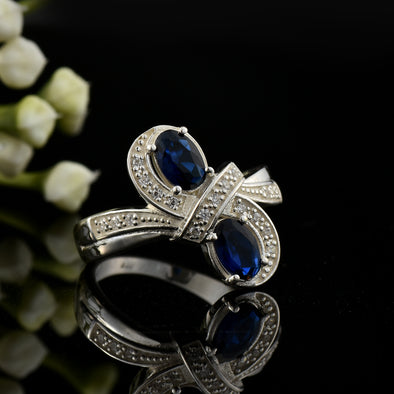 6x4mm Oval Blue Sapphire Crossover Ring - 925 Sterlign Silver