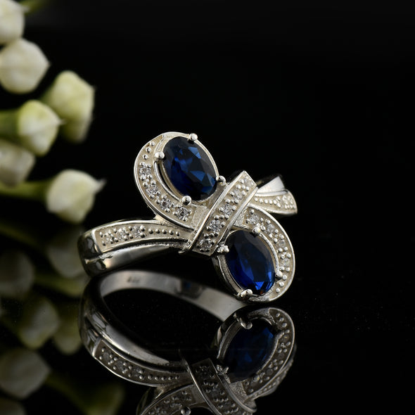 6x4mm Oval Blue Sapphire Crossover Ring - 925 Sterlign Silver