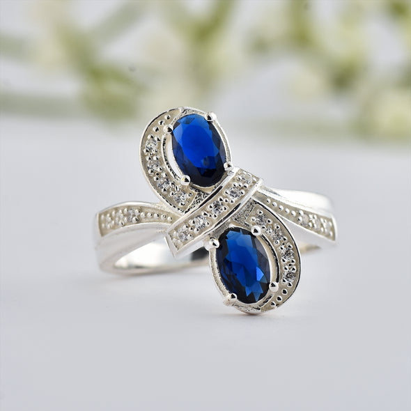 6x4mm Oval Blue Sapphire Crossover Ring - 925 Sterlign Silver
