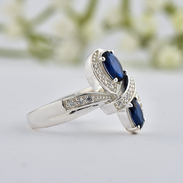 6x4mm Oval Blue Sapphire Crossover Ring - 925 Sterlign Silver