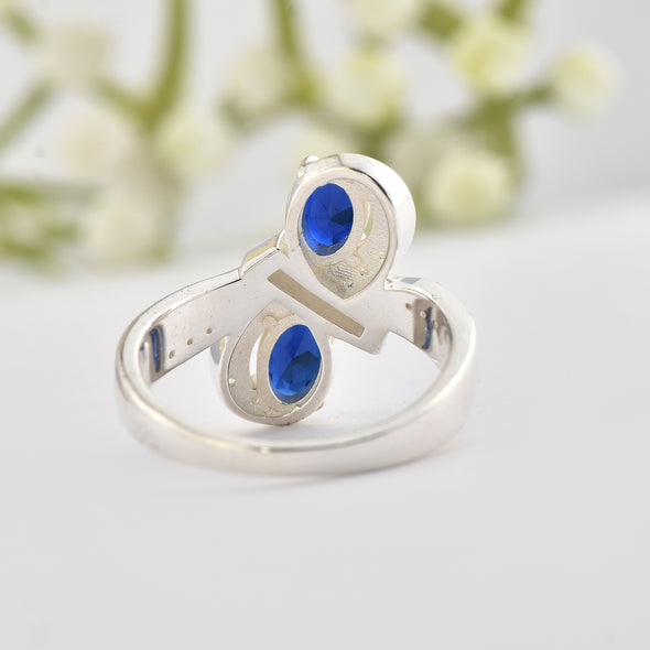 6x4mm Oval Blue Sapphire Crossover Ring - 925 Sterlign Silver