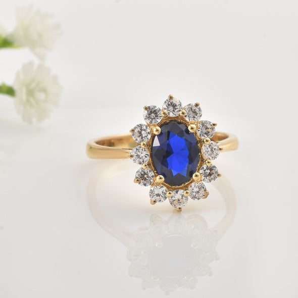 925 Sterling Silver 8x6MM Oval Blue Sapphire Halo with CZ Accents Ring