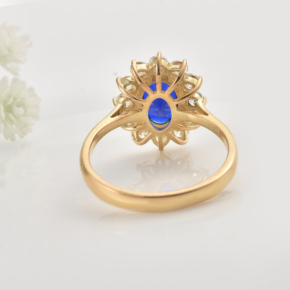 925 Sterling Silver 8x6MM Oval Blue Sapphire Halo with CZ Accents Ring