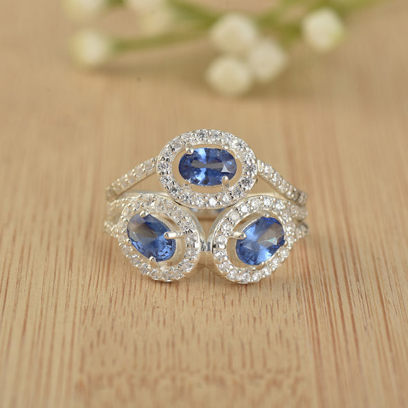 6x4mm Oval Tanzanite Triple Halo Design Ring 925 Sterling Silver